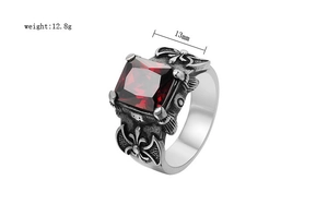 Macro detail of gothic viking axe ring with red gemstone and 12.8g weight markers