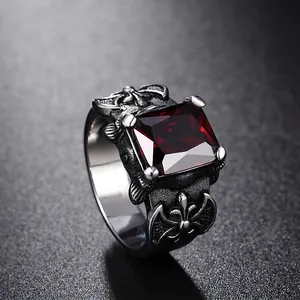 Vintage Viking axe ring with square red ruby stone in distressed stainless steel