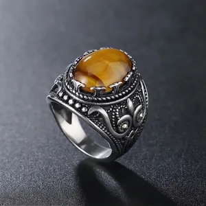 Vintage punk style titanium steel ring for men featuring an oval tiger eye stone inlay