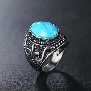 Retro punk titanium steel ring with large oval turquoise gemstone and engraved patterns