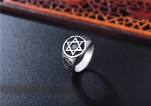 Macro shot of vintage titanium steel ring for men showing detailed star of david engraving