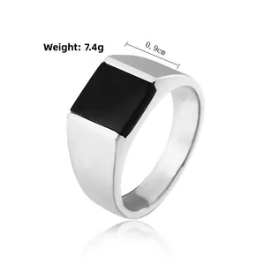 Detailed view of men's titanium steel signet ring with black agate inlay and 0.9cm width