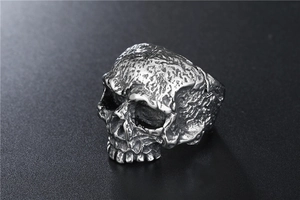 Macro detail of gothic skull ring with vintage distressed texture and punk rock finish