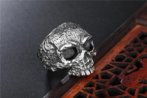 Macro shot of gothic skull ring in stainless steel with vintage bone texture