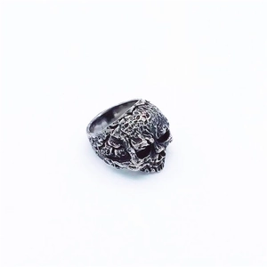 Macro shot of vintage skull ring with intricate distressed texture and gothic steel finish