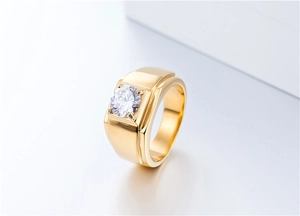 Macro shot of men's wide gold ring with center square-set zircon stone detail