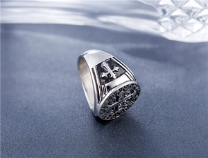 Macro shot of vintage silver St. Benedict medal ring with detailed cross relief