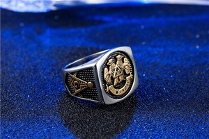 Macro shot of vintage silver Masonic 32nd degree eagle ring with Latin engraving