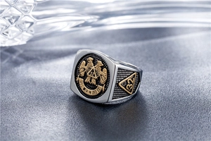 Macro shot of 32nd Degree Freemason ring featuring double-headed eagle in gold and silver