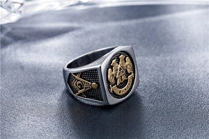 Macro shot of vintage Masonic double-headed eagle ring with gold relief and 32nd degree seal