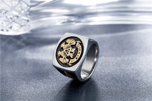 Macro detail of bicolour Freemason double-headed eagle ring with 32nd degree engraving