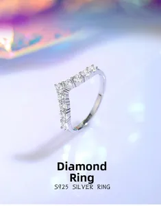 Macro detail of V-shaped S925 sterling silver ring with sparkling row diamond pavé setting