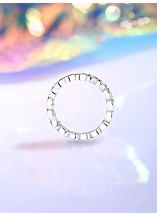 Macro shot of S925 sterling silver eternity ring with heart cubic zirconia stones