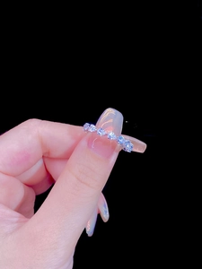 Macro shot of S925 sterling silver band ring featuring a row of sparkling cubic zirconia