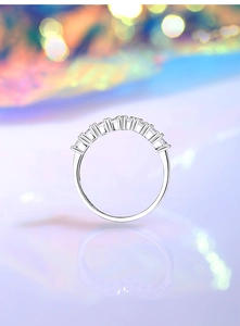 Detailed close-up of S925 sterling silver V-shaped ring with pavé sparkling stones
