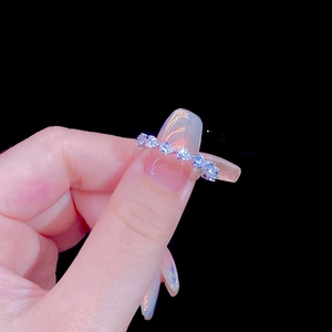 S925 sterling silver stacking ring with pear-cut cubic zirconia in a half-eternity style