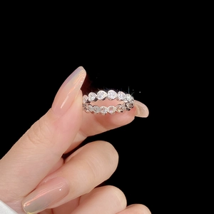 Elegant S925 sterling silver eternity ring featuring heart-cut cubic zirconia in prong setting