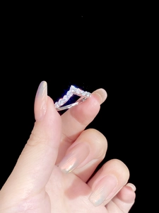 Macro shot of S925 sterling silver V-shape ring with sparkling pavé cubic zirconia