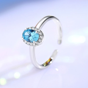 Elegant S925 silver adjustable ring featuring a large oval aquamarine stone with halo diamonds