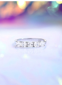Macro shot of S925 silver ring featuring five square-cut cubic zirconia in prong setting
