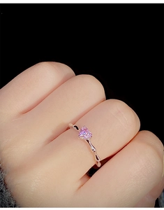 Close-up of S925 silver ring featuring pink heart gem and bamboo style band