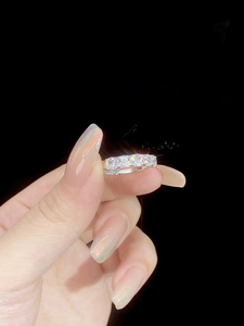 Detailed macro view of S925 sterling silver band with square cut crystal row settings