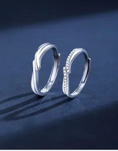 Macro shot of S925 sterling silver couple rings with twisted design and zircon inlay