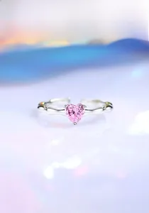 Close-up of S925 sterling silver ring featuring a pink heart-shaped stone and wavy band