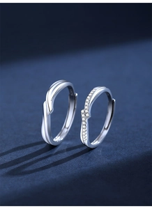 Detailed macro of S925 sterling silver couple rings with twisted design and micro-pave stones