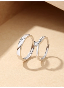 Detailed close-up of S925 sterling silver couple rings with adjustable twisted bands