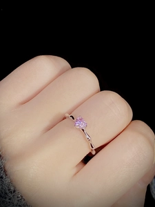 Detailed view of S925 sterling silver ring with pink heart gem and bamboo band texture