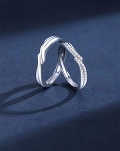 Macro shot of S925 silver couple rings featuring twisted band and micro-set cubic zirconia