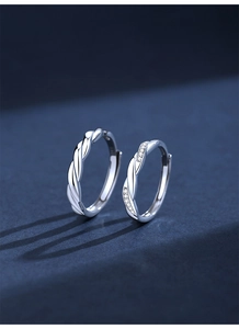 Macro detail of S925 sterling silver twisted rings with sparkling micro-pave crystals