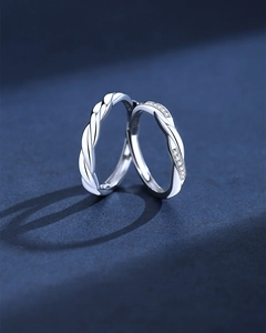 Macro view of S925 sterling silver couple rings with twisted design and pave zircon details