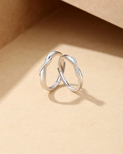 Macro shot of S925 sterling silver Mobius rings with detailed hallmark and micro-inlaid stones