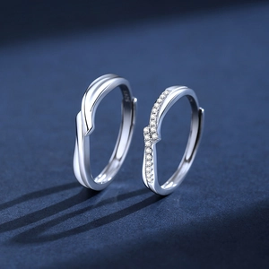 Elegant S925 sterling silver couple rings with intertwined bands and sparkling zircon stones