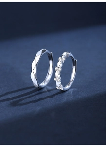 Macro shot of silver geometric ripple earrings and sparkling micro-inlaid zircon petals