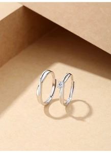 Detailed view of S925 sterling silver couple rings with heart zircon and S925 hallmark