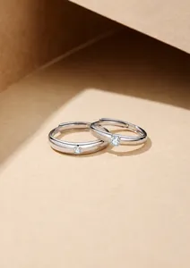 Detailed macro of S925 sterling silver couple rings with sparkling central stones