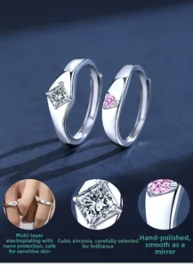 Detail view of S925 silver couple rings featuring square and heart cubic zirconia stones