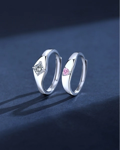 Macro view of adjustable S925 silver couple rings with square and heart crystals