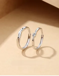 Close-up of S925 sterling silver Mobius rings for couples featuring a subtle logo stamp