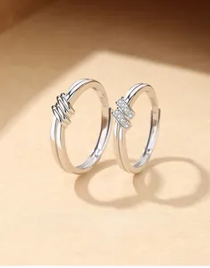 Macro close-up of S925 sterling silver couple rings with knot design and S925 hallmark
