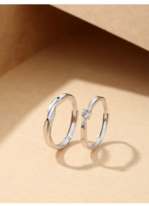 Detailed macro view of S925 sterling silver couple rings showing the S925 hallmark stamp