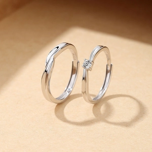 S925 sterling silver Mobius rings for couples featuring a round cut stone and twisted band