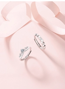 Detailed macro of S925 sterling silver crown ring and geometric band with clear S925 hallmarks