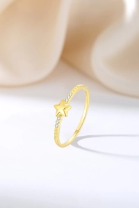Macro shot of S925 sterling silver star ring with gold plating and cubic zirconia