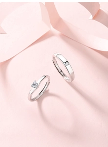 Macro detail of S925 sterling silver adjustable rings with heart and round stones