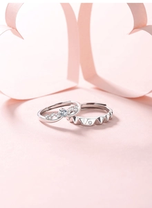 Detail of S925 silver couple rings with wavy zircon pave and geometric rivet design
