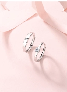 Detailed macro view of S925 sterling silver couple rings showing the S925 hallmark stamp